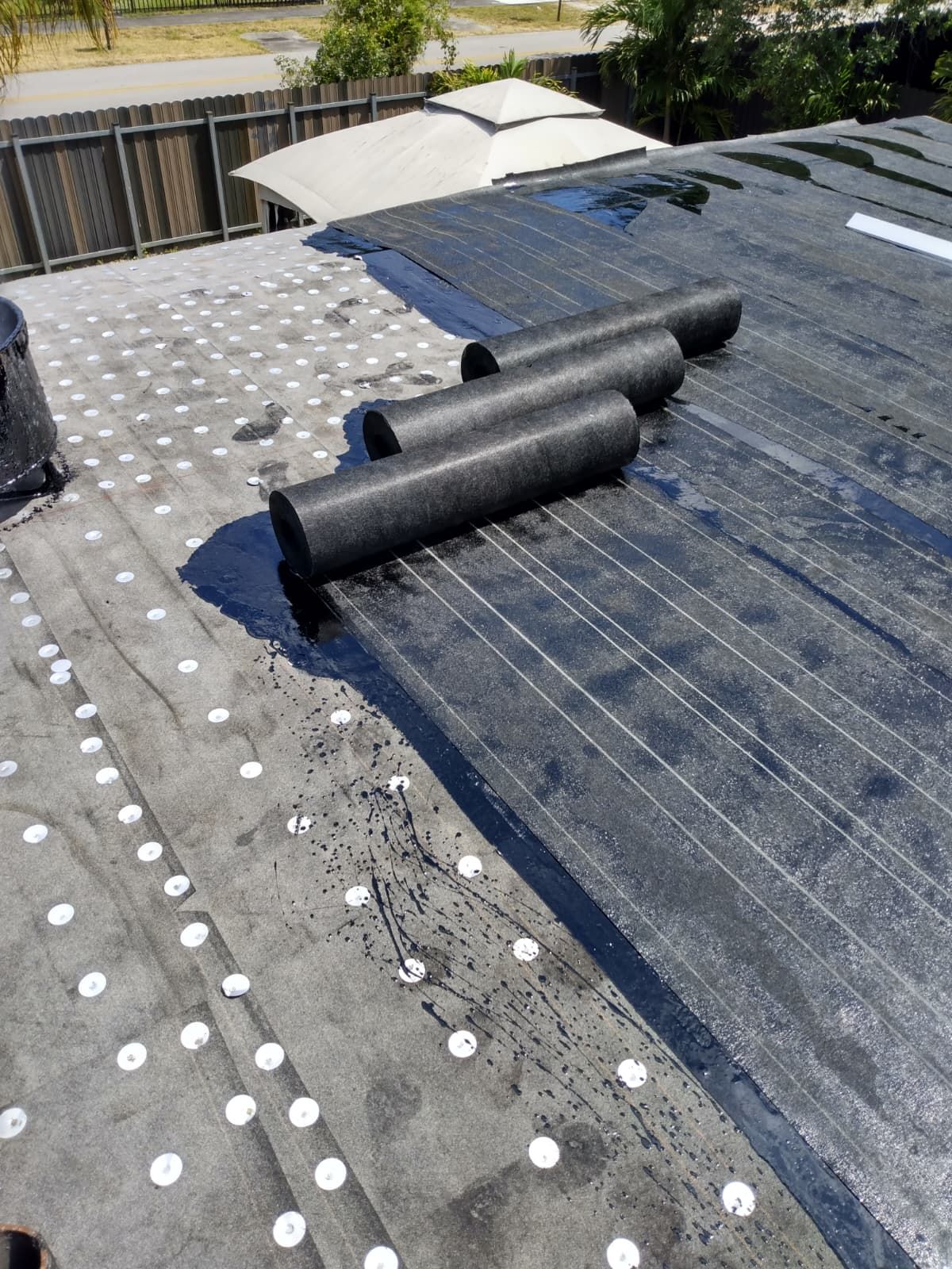 Underlayment rolls and fastened base sheet