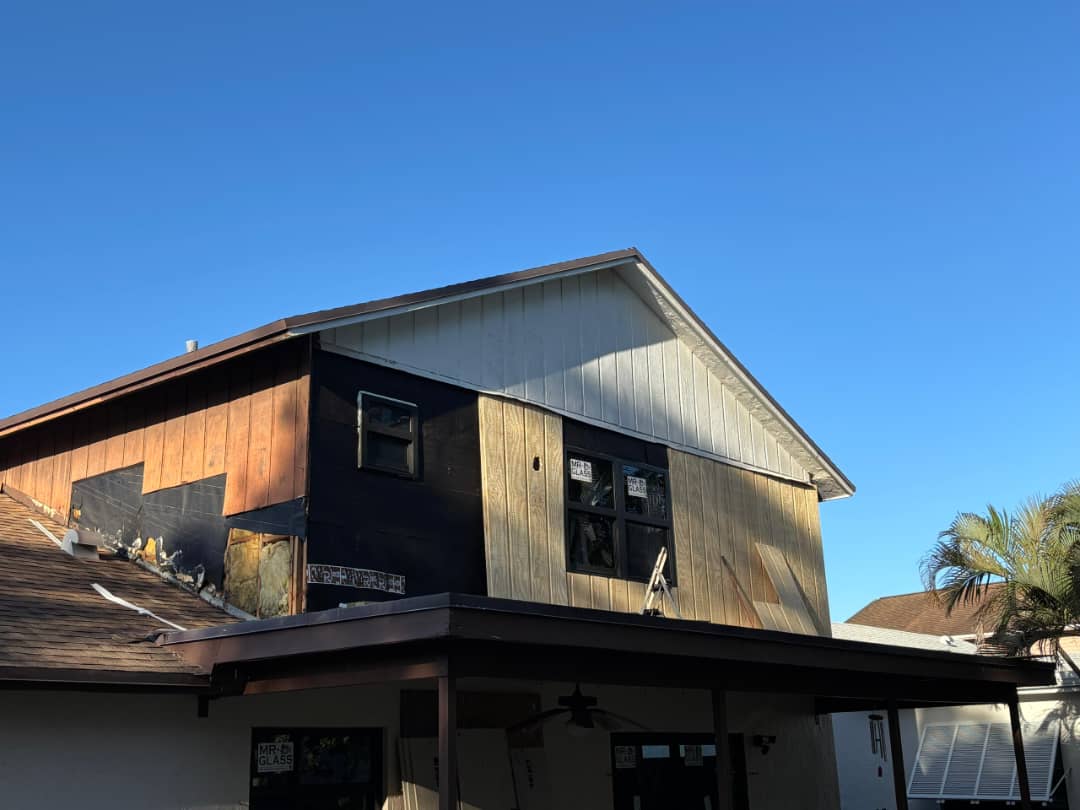 Home exterior during window installation