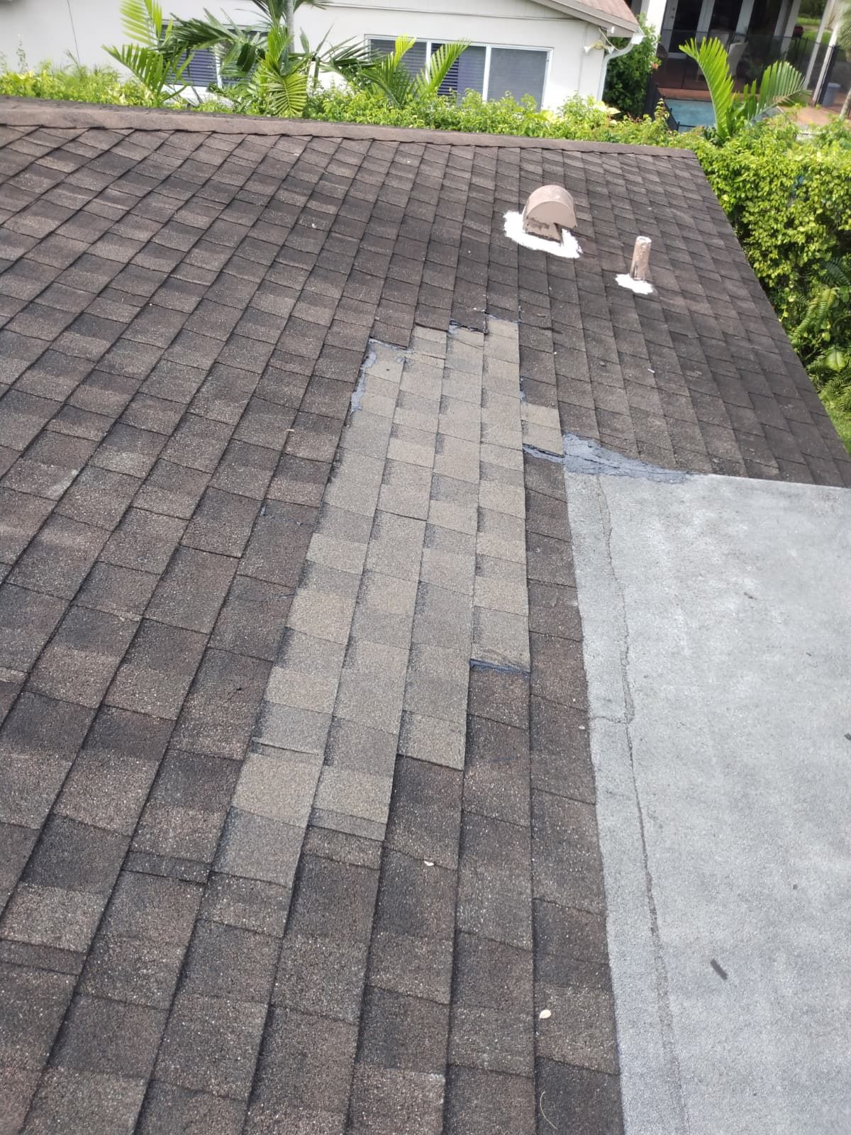 Shingle roof repair in progress