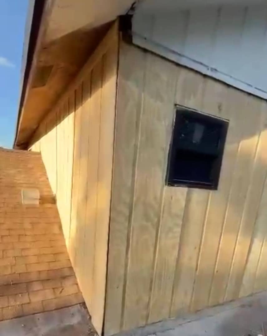 New window set in freshly sheathed wall