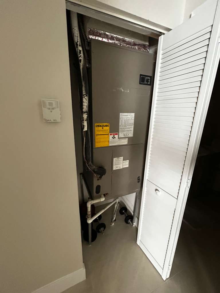 Indoor air handler installed in a closet